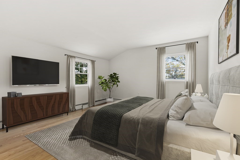 59 Overlook Road Marblehead, MA 01945 - Photo 12 of 16 a bedroom with a bed and a flat screen tv