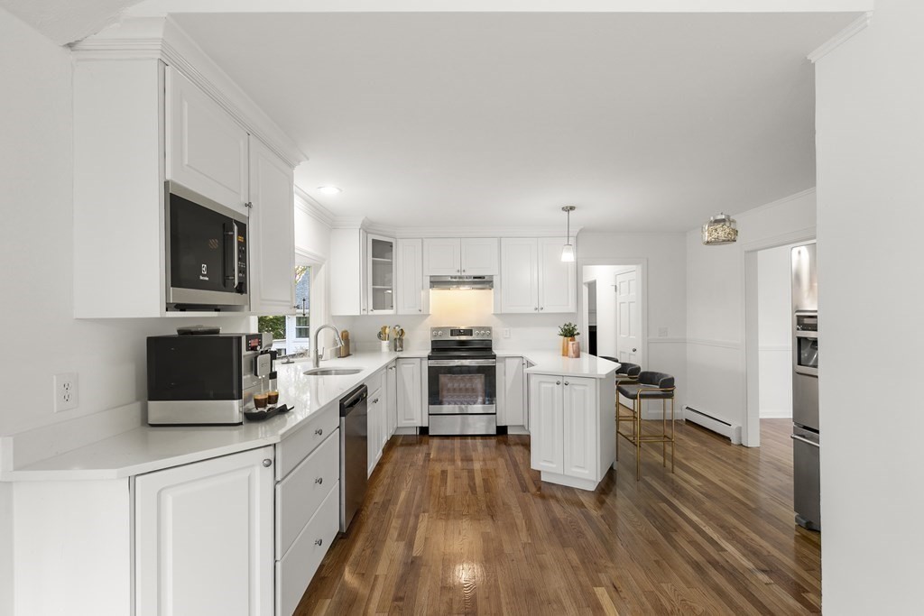 59 Overlook Road Marblehead, MA 01945 - Photo 3 of 16 a kitchen with a sink wooden floor and stainless steel appliances