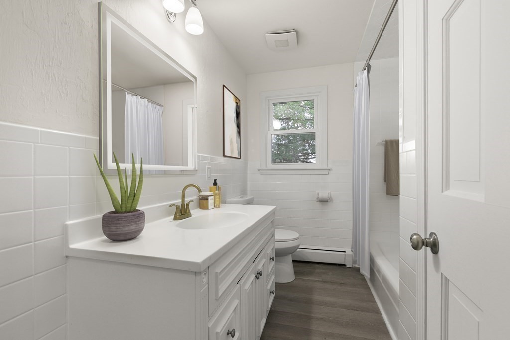 59 Overlook Road Marblehead, MA 01945 - Photo 10 of 16 a bathroom with a sink a toilet and a mirror