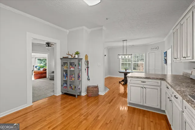 a kitchen view with wooden floor and floors