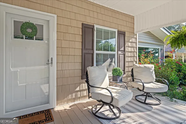 a view of a chairs and table in patio