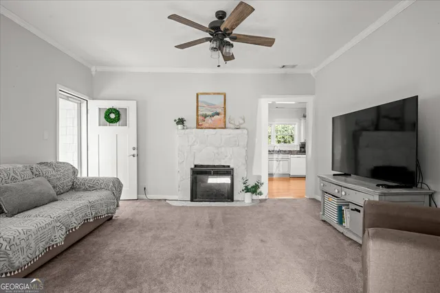 a living room with furniture and a flat screen tv