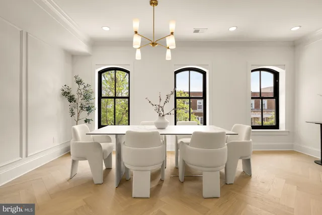 a very nice looking dining room with a table and chairs