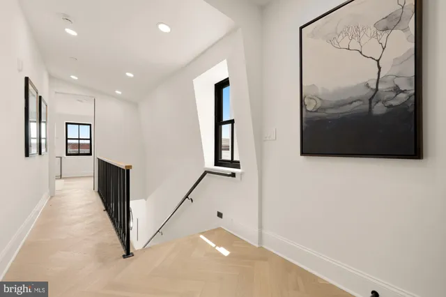 a large white bed in a white room