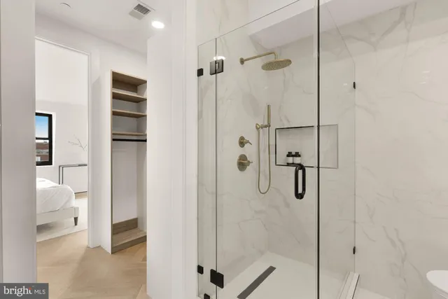 a bathroom with a double vanity sink and mirror