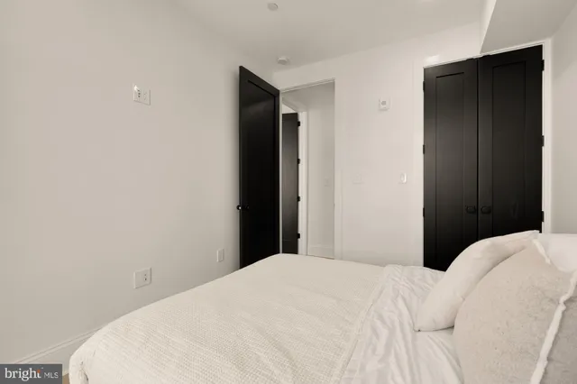 a bathroom with a sink toilet vanity and shower