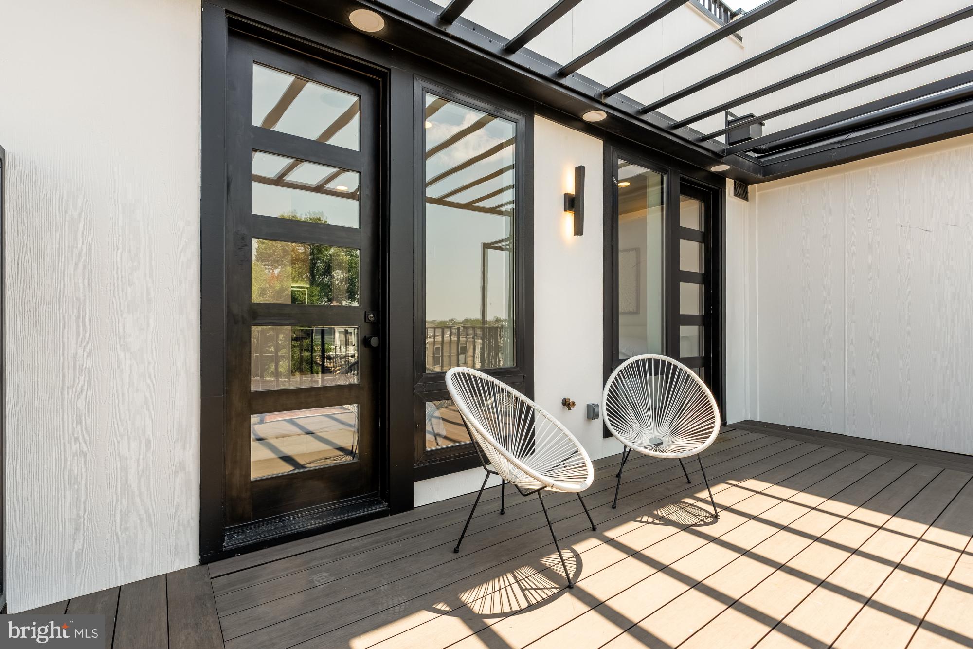 733 Euclid Street Northwest, Unit 302 Washington, DC 20001 - Photo 47 of 55 a view of a hallway with wooden floor and a fireplace