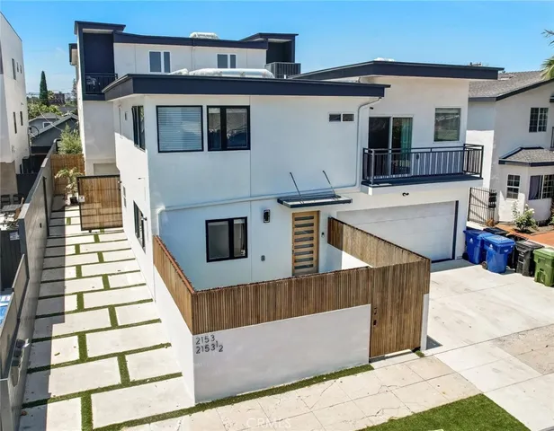 a view of a backyard with plants and a patio
