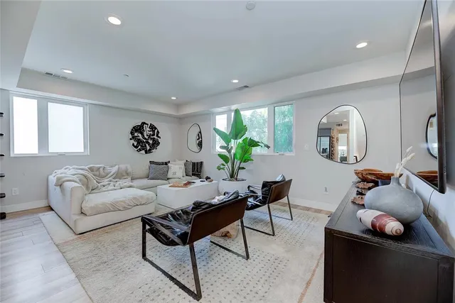 a bedroom with a large bed and a couch