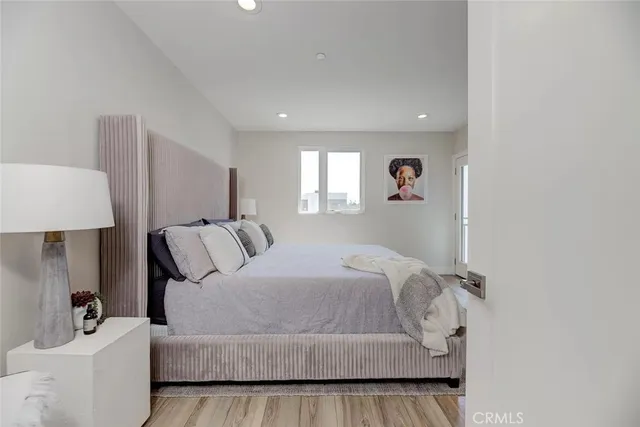a view of a workspace with furniture and wooden floor