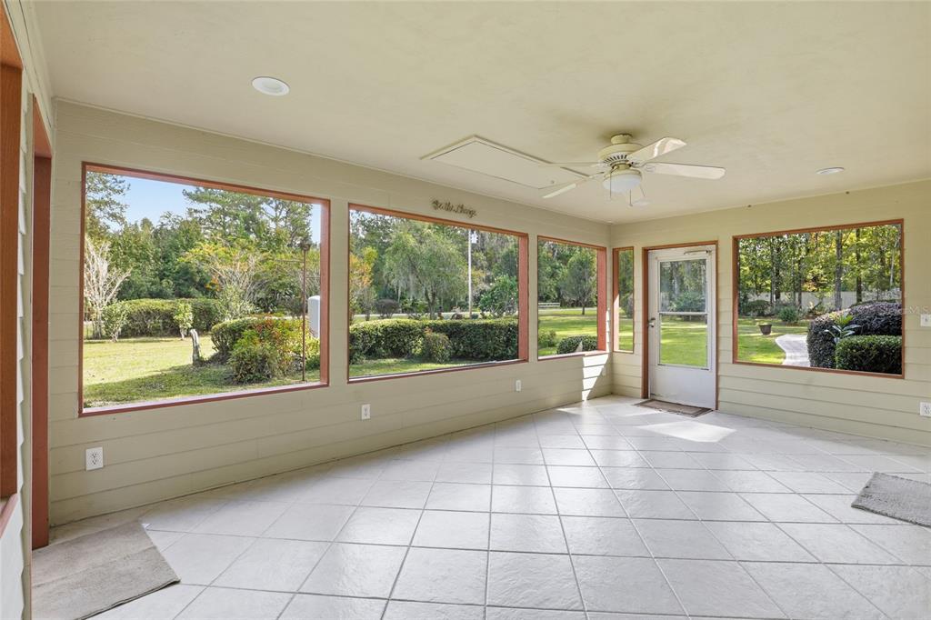 24214 Northwest 52nd Terrace Alachua, FL 32615 - Photo 3 of 22 a view of an empty room with a large window