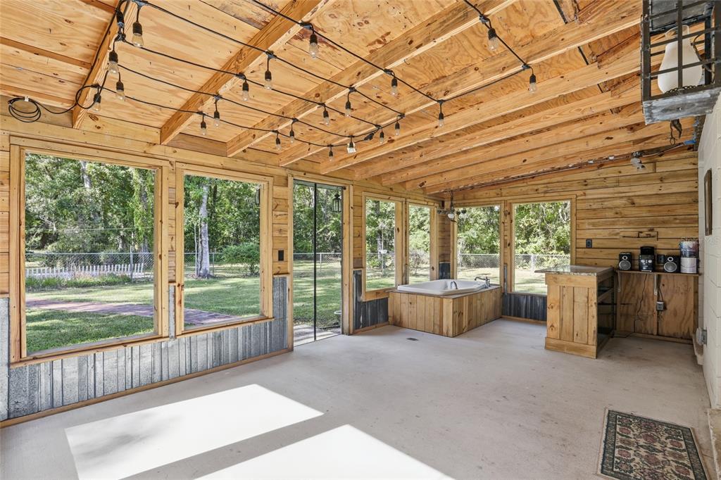 24214 Northwest 52nd Terrace Alachua, FL 32615 - Photo 7 of 22 a living room with furniture and a flat screen tv