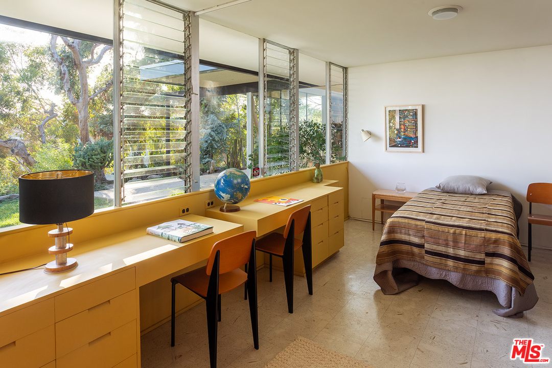 1531 North Tigertail Road Los Angeles, CA 90049 - Photo 16 of 27 a bedroom with a bed and a table