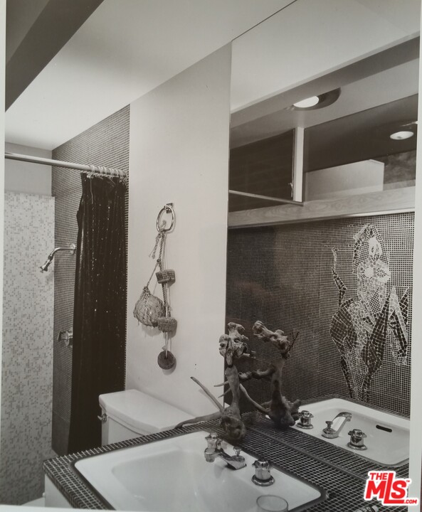 1531 North Tigertail Road Los Angeles, CA 90049 - Photo 18 of 27 a bathroom with a sink and mirror