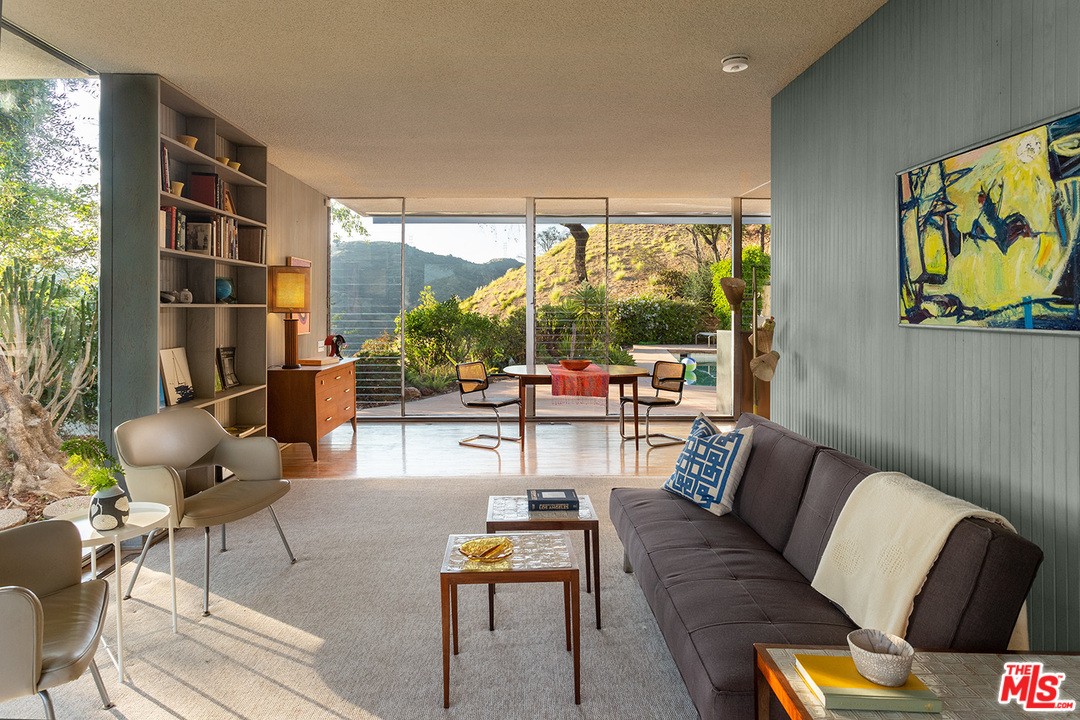 1531 North Tigertail Road Los Angeles, CA 90049 - Photo 7 of 27 a living room with fireplace furniture and a large window