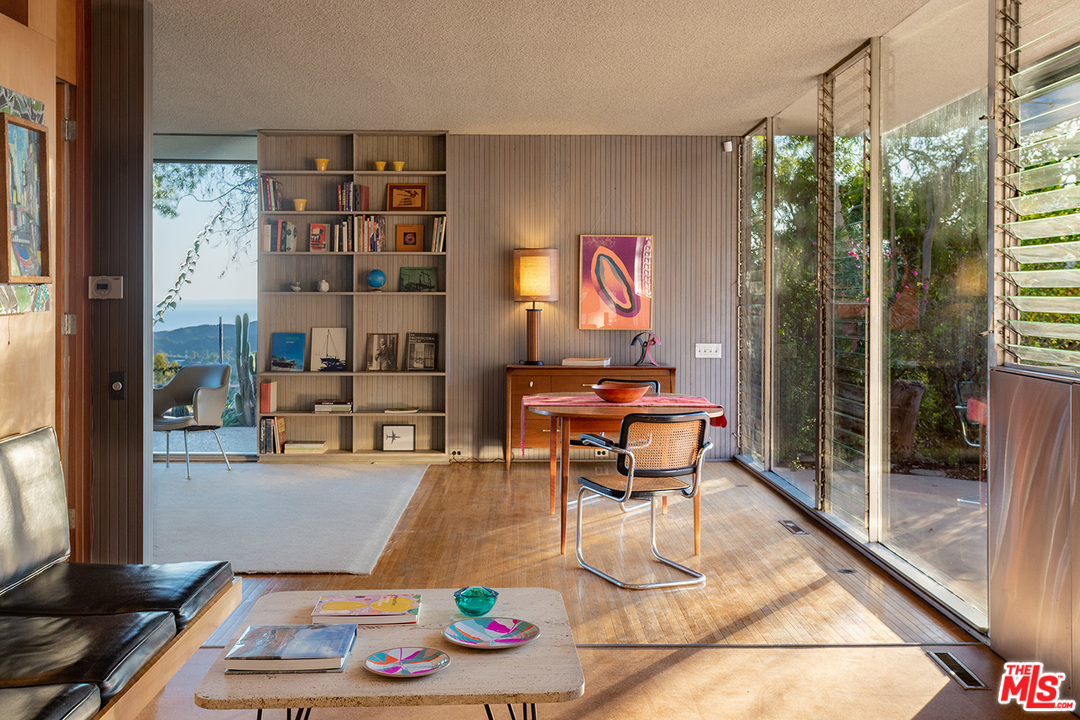 1531 North Tigertail Road Los Angeles, CA 90049 - Photo 9 of 27 a living room with furniture and a floor to ceiling window