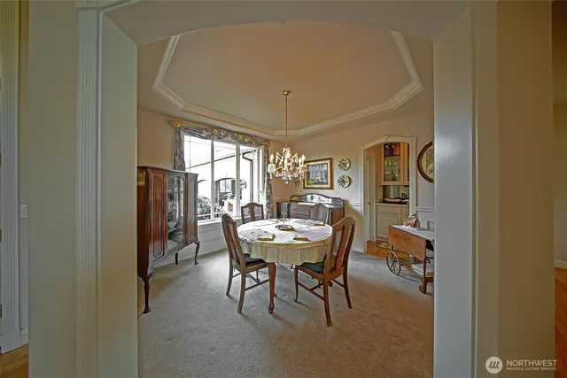 a dining room with furniture and window