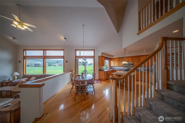 a livingroom with furniture staircase and a kitchen