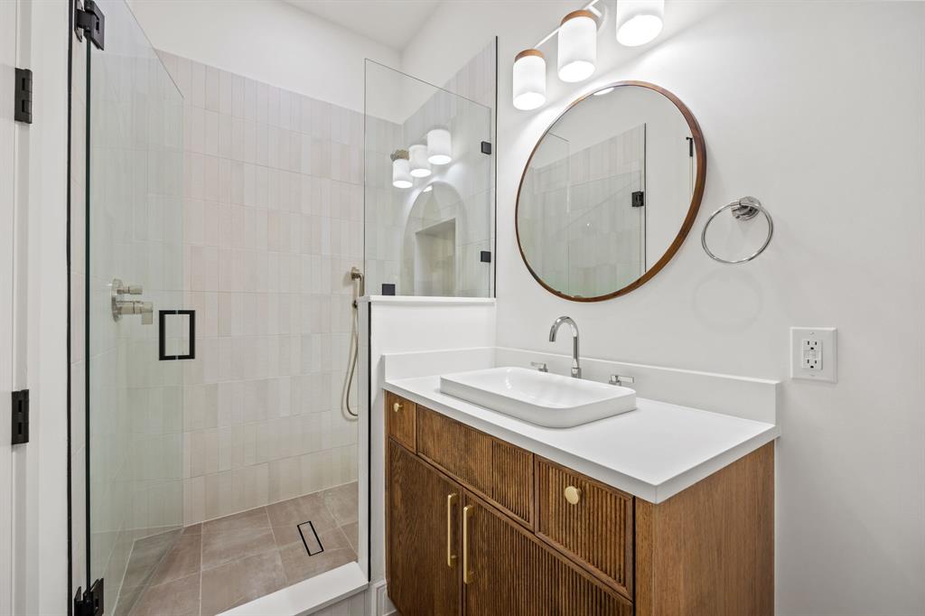 4557 Ridge Road Dallas, TX 75229 - Photo 21 of 37 a bathroom with a sink and a mirror