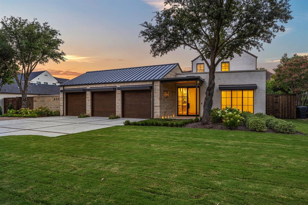 4557 Ridge Road Dallas, TX 75229 - Photo 6 of 37 a front view of a house with a garden