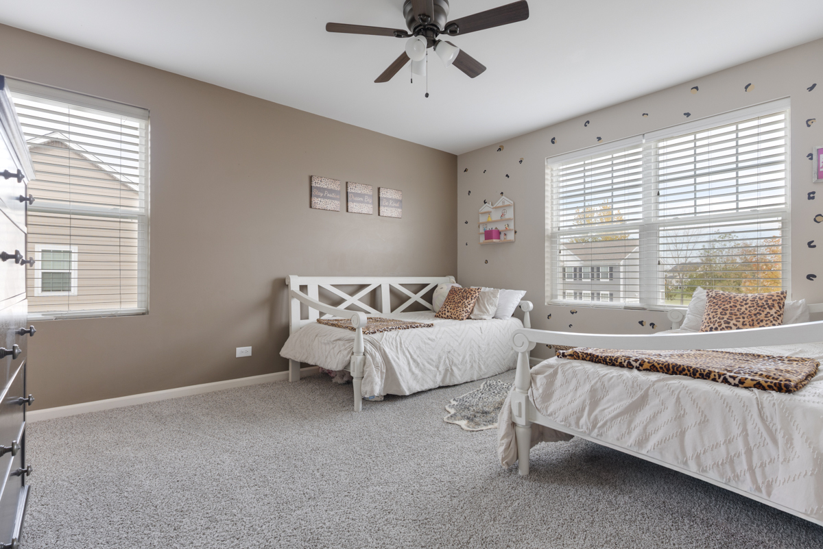 3827 Trillium Trail Elgin, IL 60124 - Photo 13 of 29 a spacious bedroom with a bed and a window