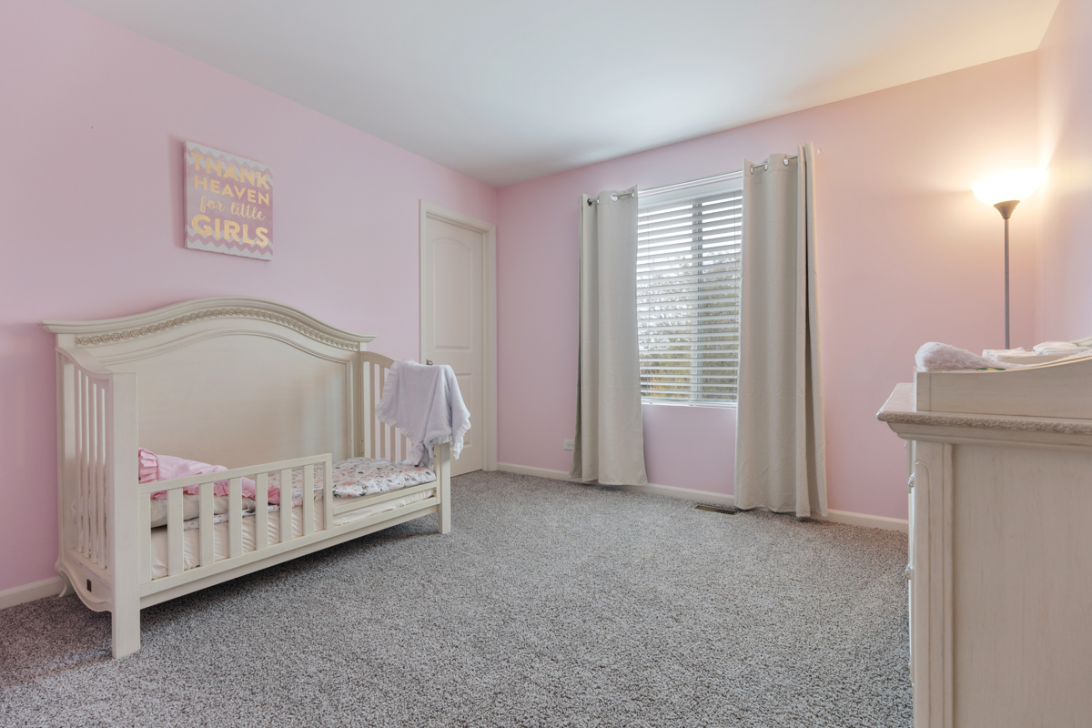 3827 Trillium Trail Elgin, IL 60124 - Photo 14 of 29 a view of a bedroom with a baby bed