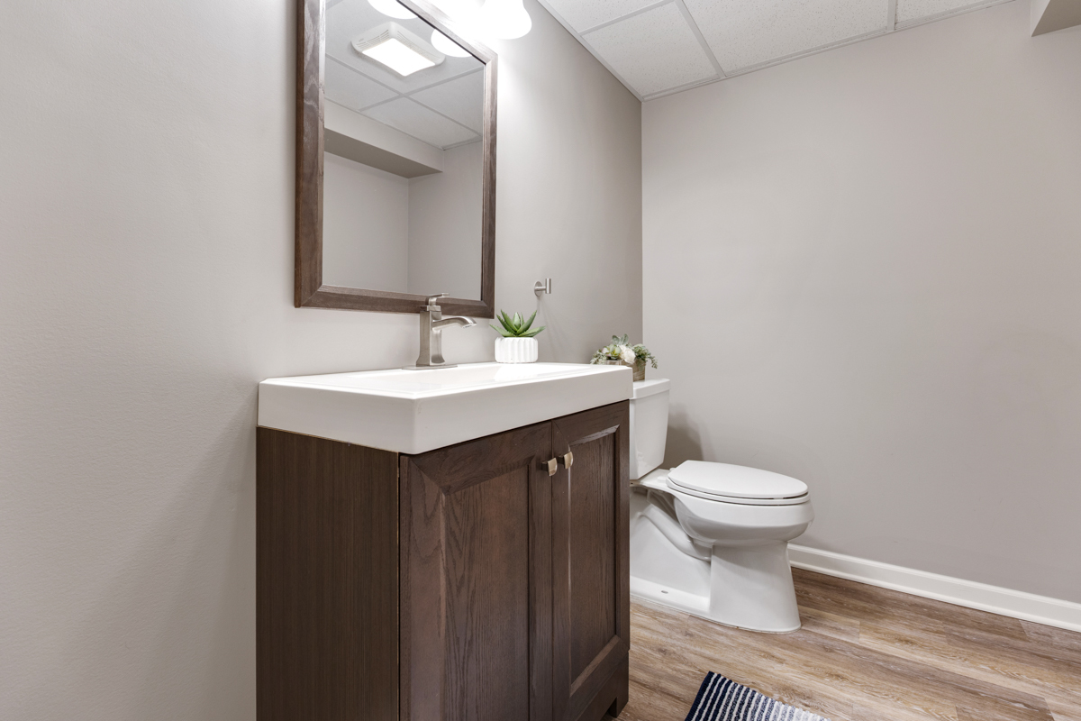3827 Trillium Trail Elgin, IL 60124 - Photo 22 of 29 a bathroom with a sink vanity mirror and toilet