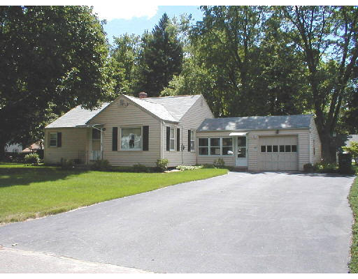 55 Brookside Circle Springfield, MA 01129 - Photo 1 of 1 a front view of a house with a yard and garage