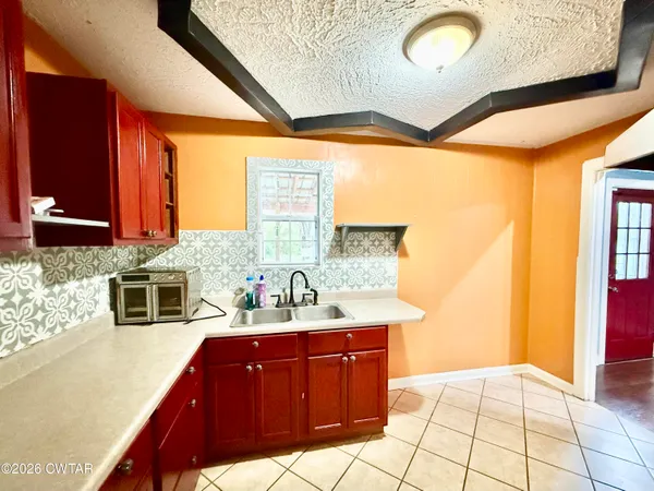 a bathroom with a sink a vanity and a mirror