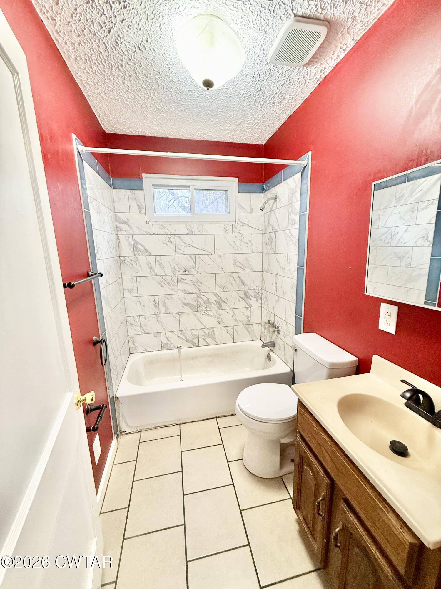 344 Phillips Street Jackson, TN 38301 - Photo 16 of 33 a bathroom with a sink a toilet and shower