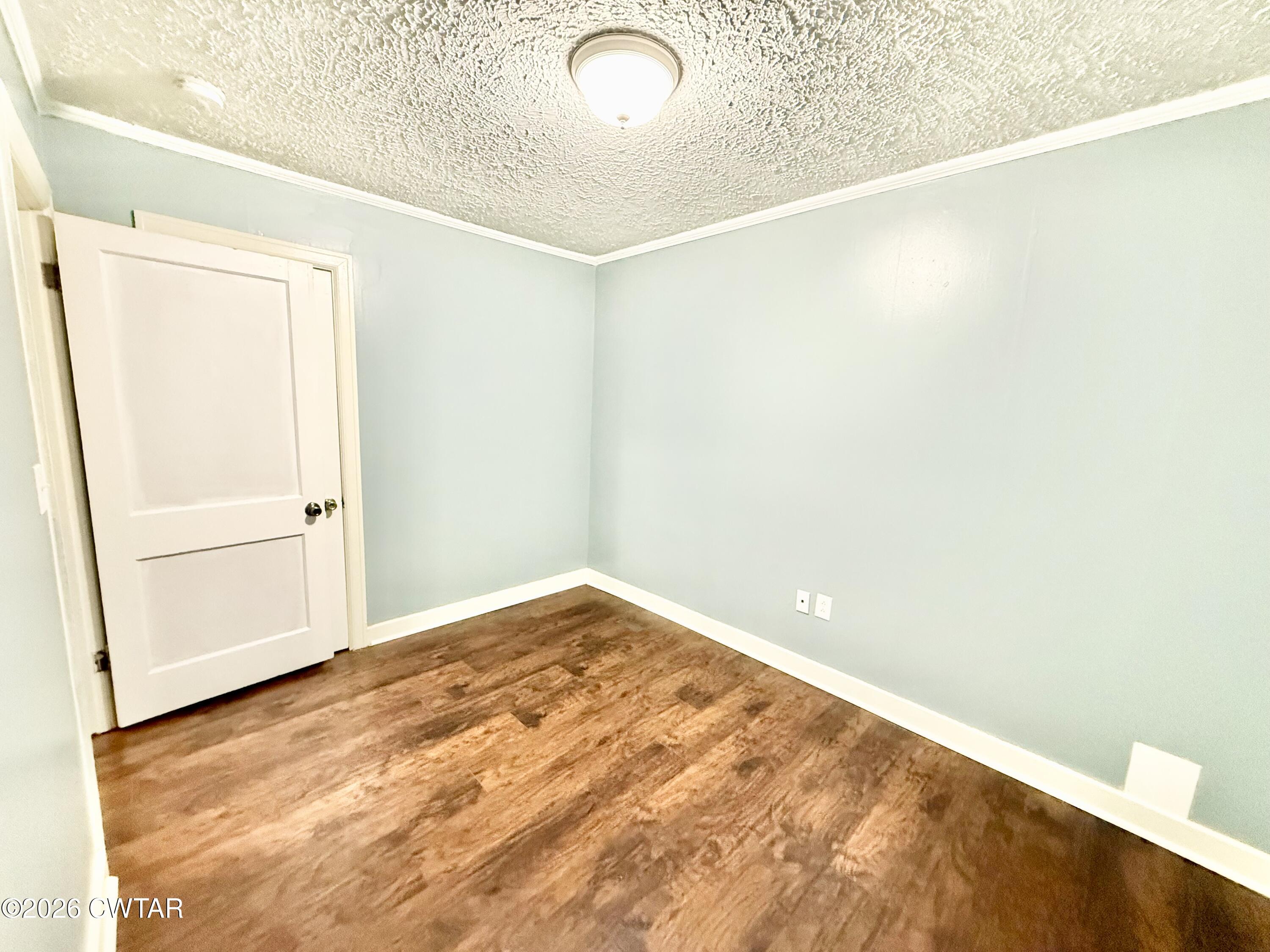 344 Phillips Street Jackson, TN 38301 - Photo 22 of 33 a view of empty room with wooden floor