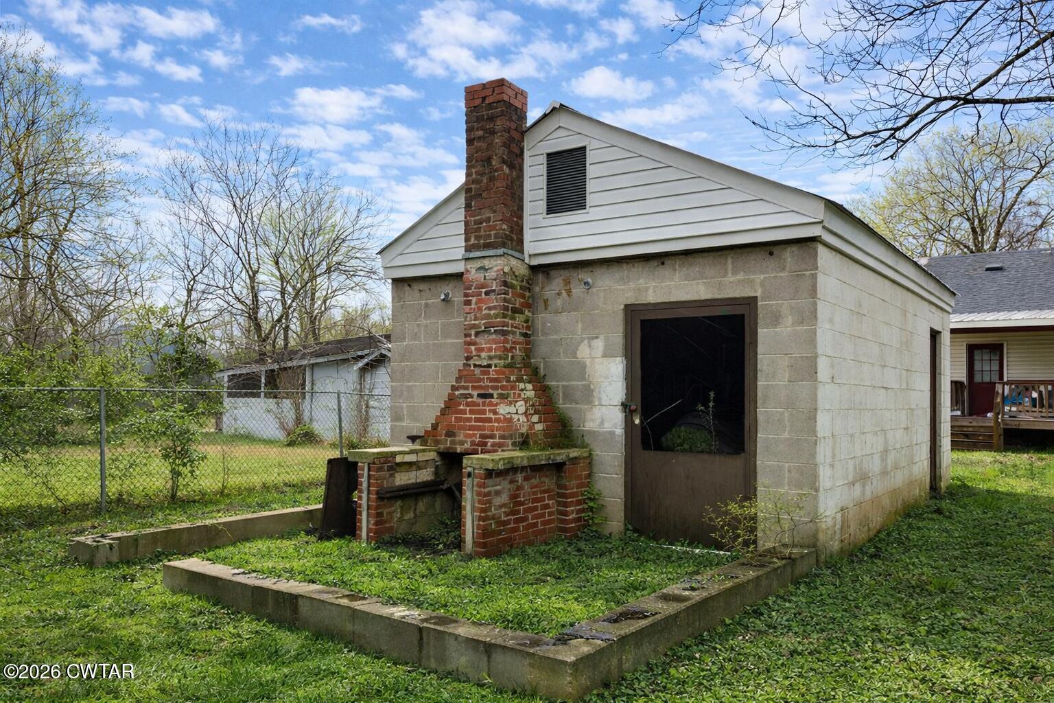 344 Phillips Street Jackson, TN 38301 - Photo 28 of 33 a view of a house with a yard