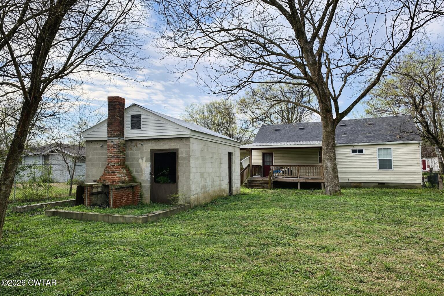344 Phillips Street Jackson, TN 38301 - Photo 29 of 33 a view of a house with a yard