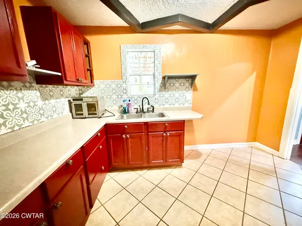 a bathroom with a sink a vanity and a mirror