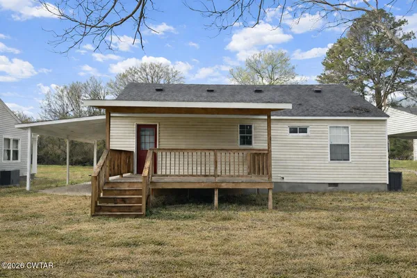 a view of a house with a bed and wooden roof