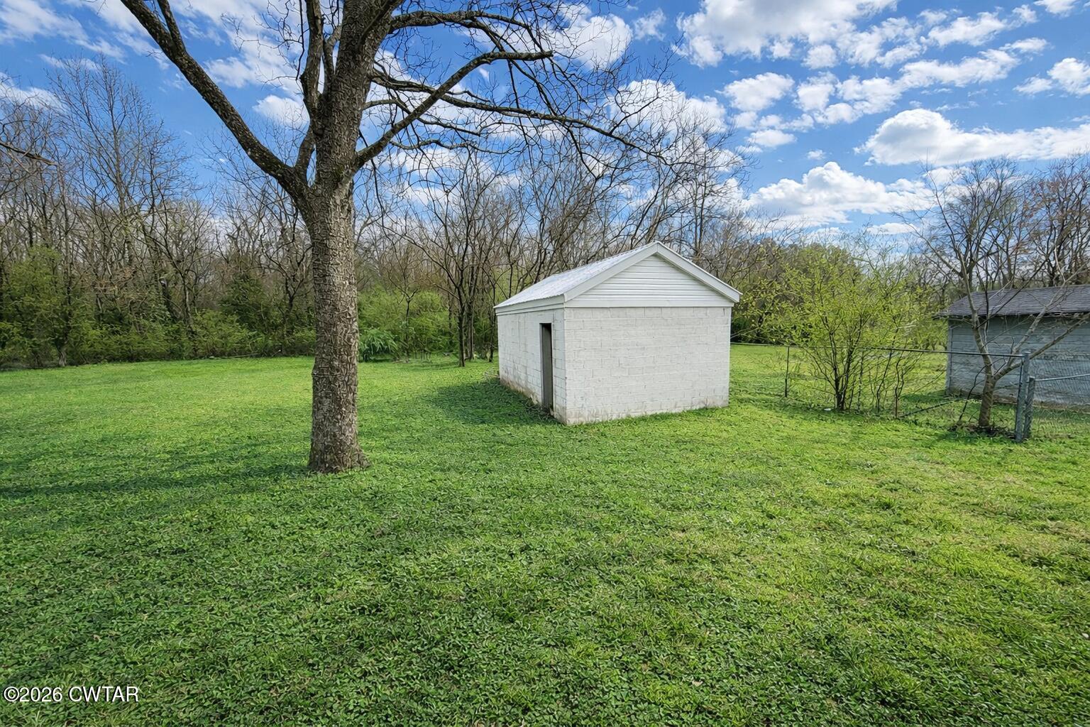 344 Phillips Street Jackson, TN 38301 - Photo 5 of 33 a view of a backyard with large trees