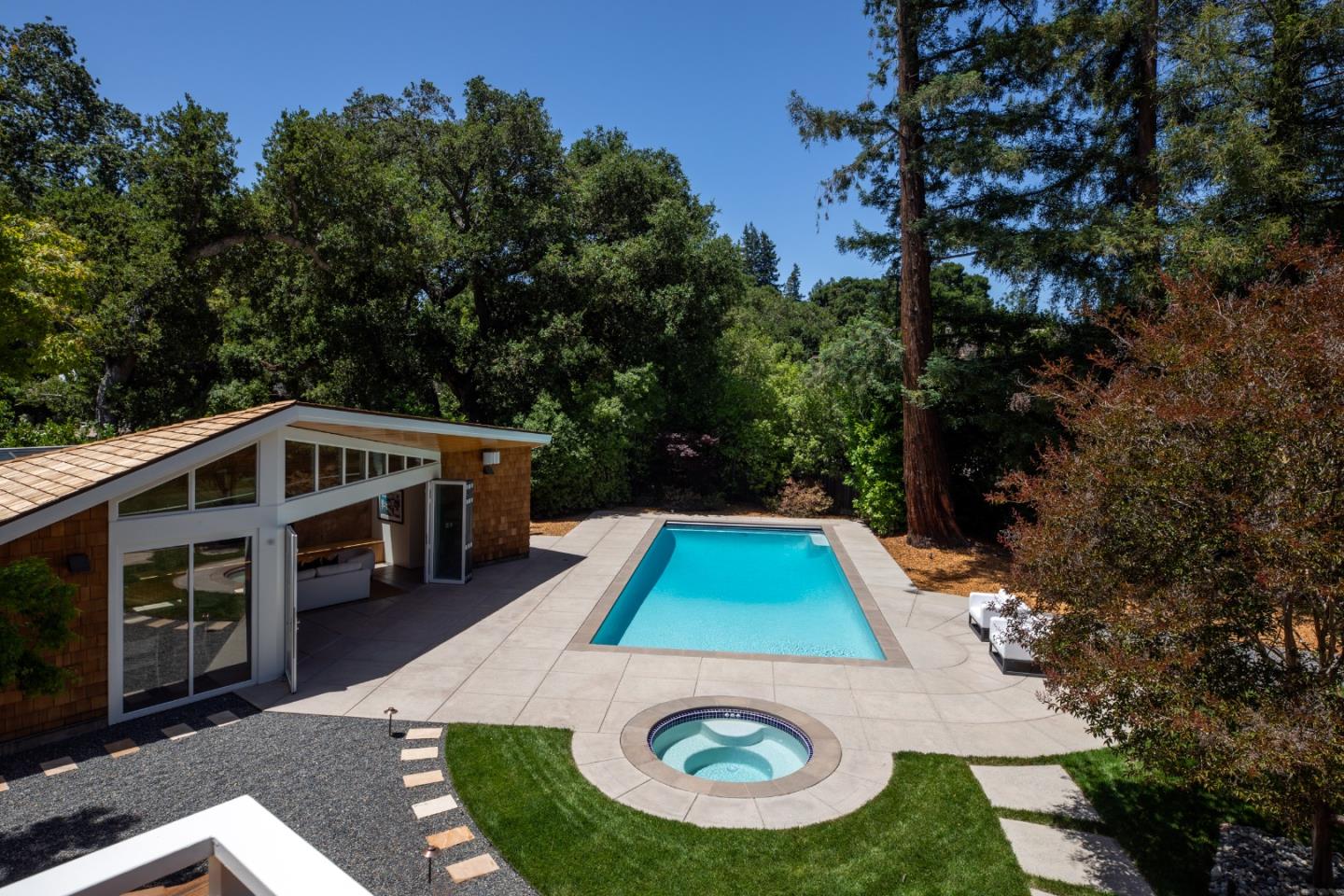 2 Mosswood Way Atherton, CA 94027 - Photo 19 of 38 a view of a swimming pool with a yard