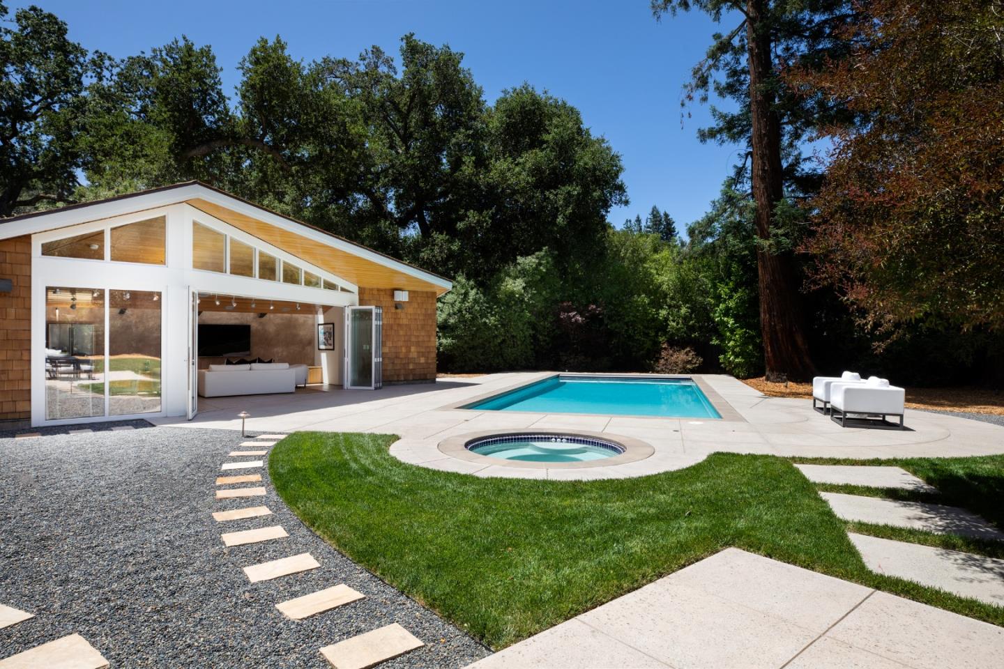 2 Mosswood Way Atherton, CA 94027 - Photo 21 of 38 a front view of a house with a yard