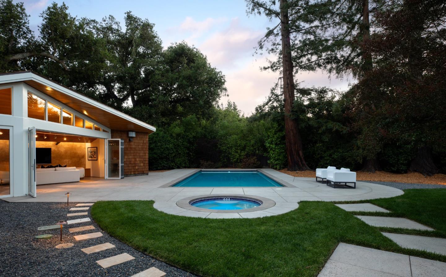2 Mosswood Way Atherton, CA 94027 - Photo 23 of 38 a backyard of a house with fountain table and chairs