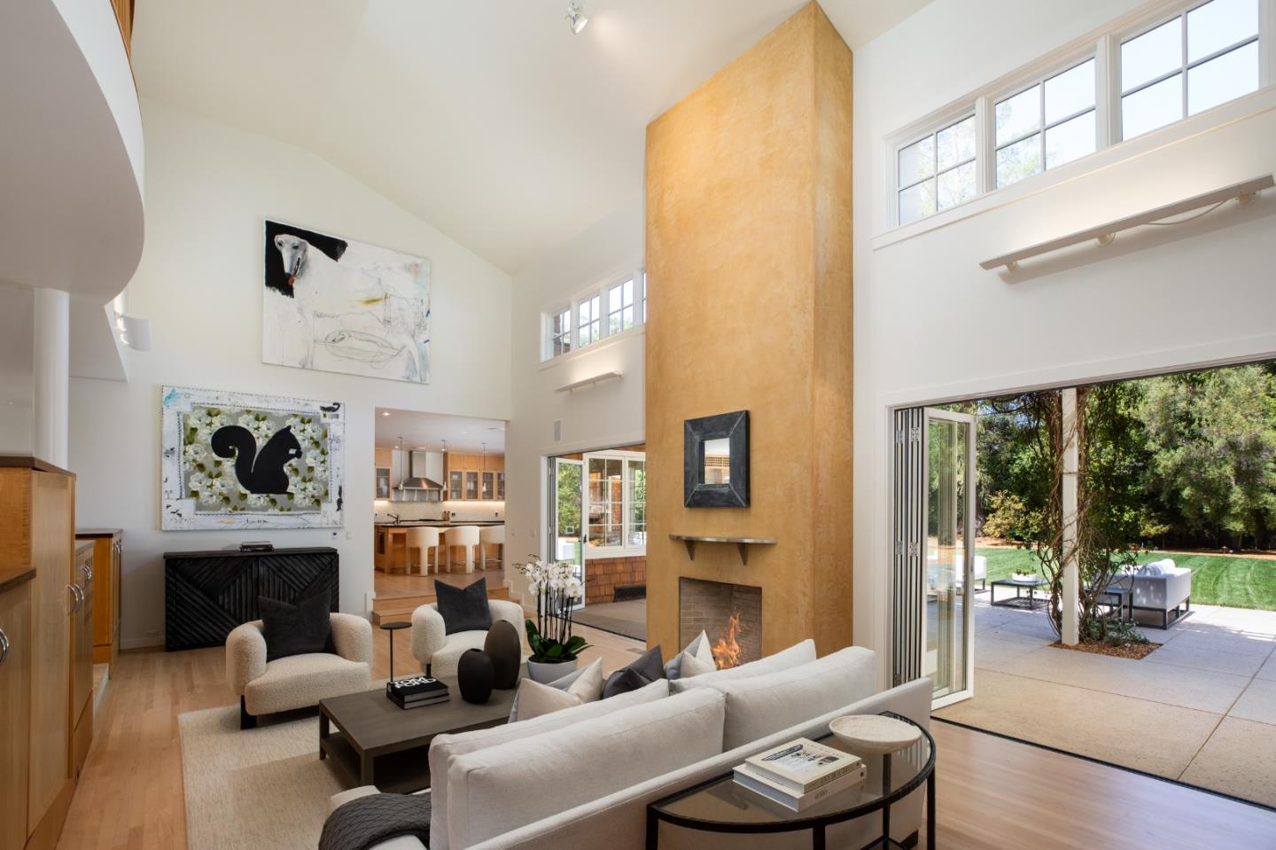 2 Mosswood Way Atherton, CA 94027 - Photo 7 of 38 a living room with furniture a fireplace and a large window with garden view