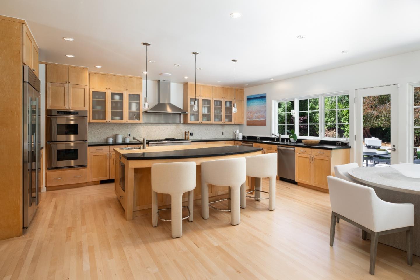 2 Mosswood Way Atherton, CA 94027 - Photo 10 of 38 a large kitchen with a table and chairs