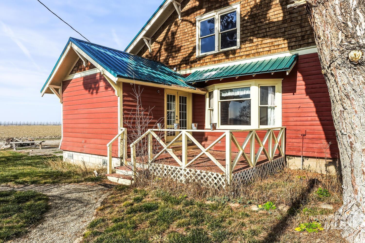 22573 Travis Road Wilder, ID 83676 - Photo 25 of 30 Rear view of property with a metal roof