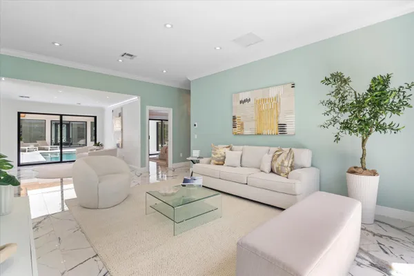 a kitchen with stainless steel appliances kitchen island granite countertop a sink and a stove