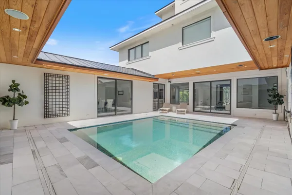 a view of indoor pool and sitting area