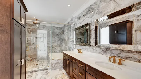 a bathroom with a bathtub and shower