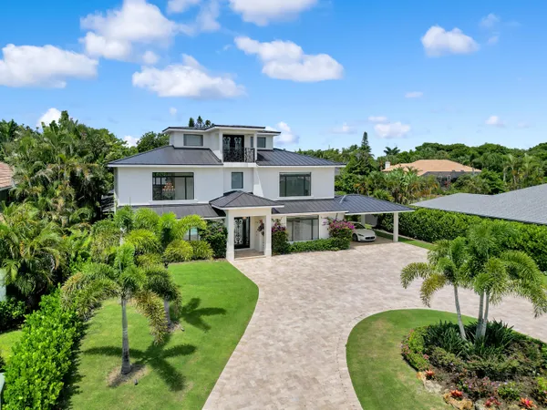 an aerial view of a house with a garden