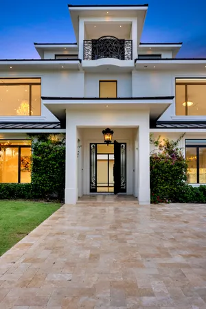 a front view of a house with garden