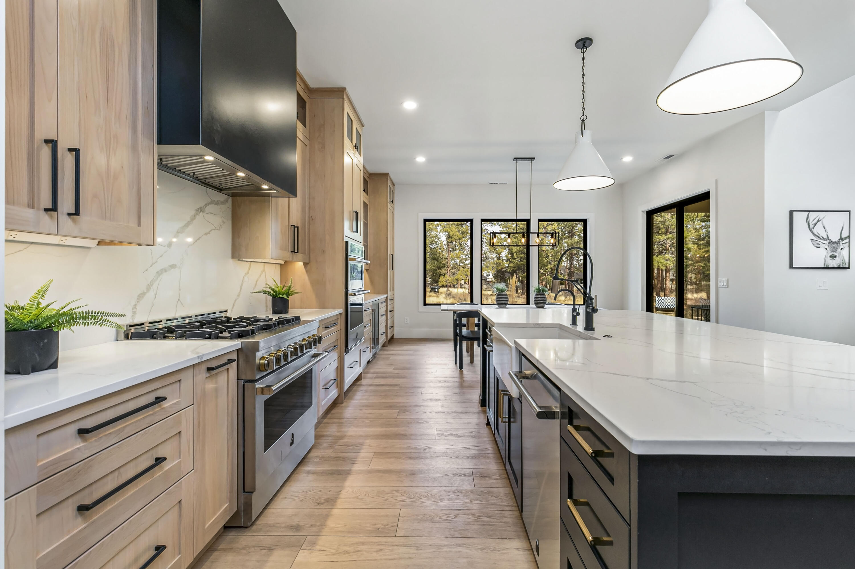 19550 Buck Canyon Road Bend, OR 97702 - Photo 6 of 28 a large kitchen with granite countertop a stove and a sink