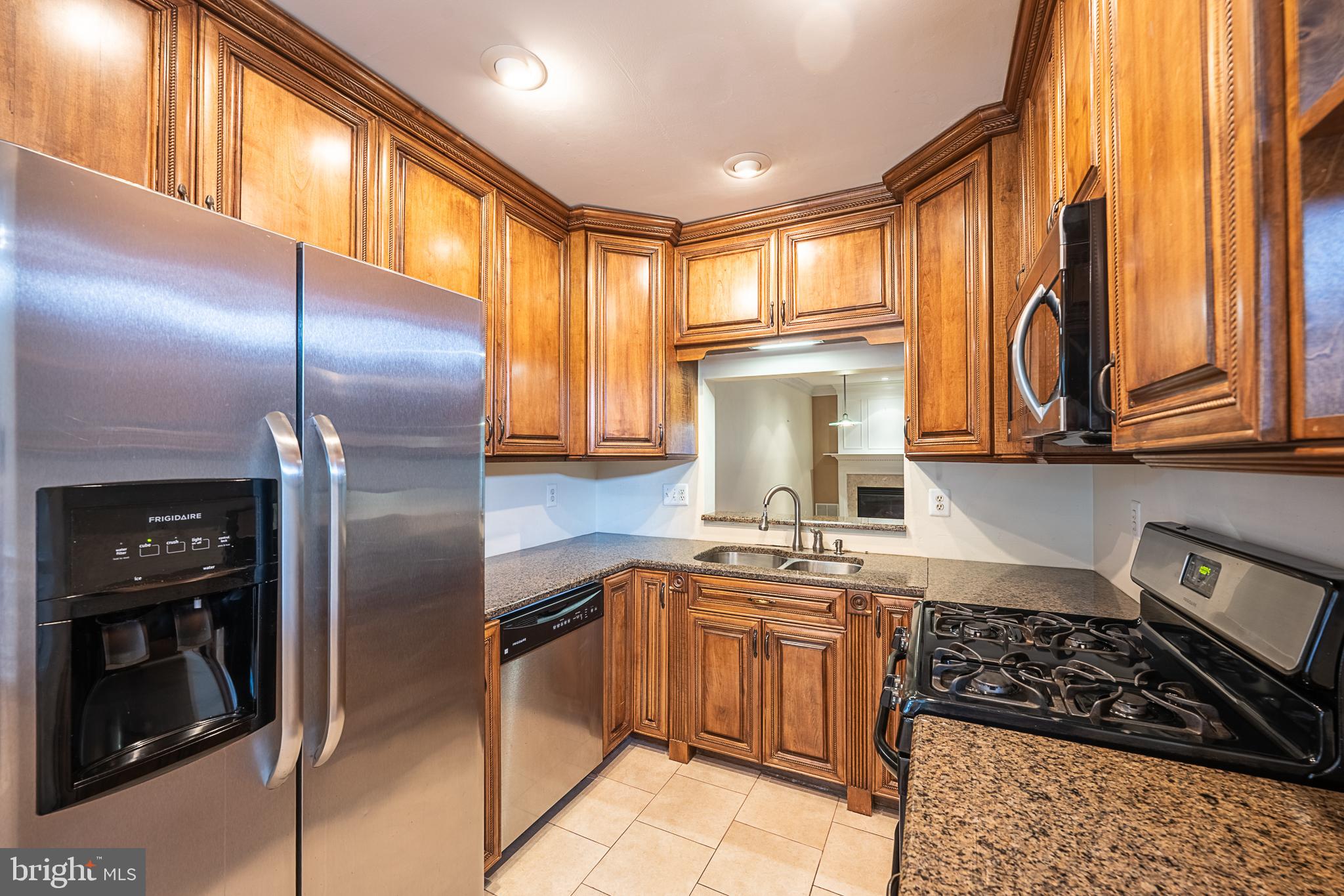 5920 Terrapin Place Alexandria, VA 22310 - Photo 12 of 67 a kitchen with stainless steel appliances granite countertop a stove a sink and a refrigerator