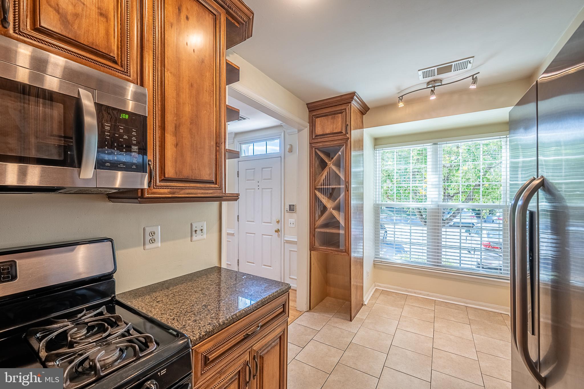 5920 Terrapin Place Alexandria, VA 22310 - Photo 16 of 67 a kitchen with granite countertop a stove and a sink